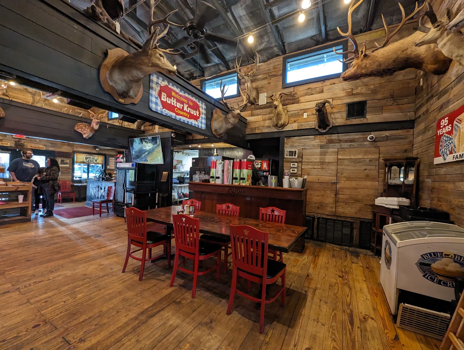 Rustic dining room at Richter's Antler Cafe decorated with taxidermy deer mounts and antlers